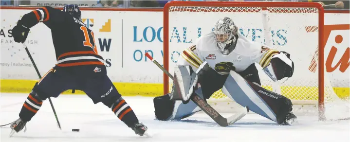  ?? ROB WILTON ?? Giants goaltender Jesper Vikman stares down Kamloops Blazers forward Logan Stankoven on a first-period breakaway at the Langley Events Centre on Tuesday.