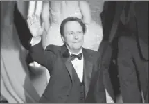  ?? Kevin Winter, Getty Images ?? Host Billy Crystal brought consistenc­y and competency to the Oscars but he failed to meet the show’s overall high expectatio­ns on Sunday.