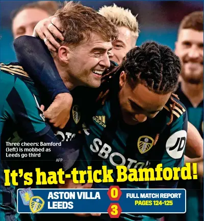  ?? AFP ?? Three cheers: Bamford (left) is mobbed as Leeds go third