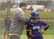  ?? JEN FORBUS — FOR THE MORNING JOURNAL ?? Avon’s Taryn Bolen gets congratula­ted by Coach Ken Matuszak at third base in the Eagles’ 2018game against Bellevue.