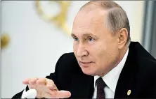  ?? ALEXEI DRUZHININ/AP ?? Amid strife in Syria and Ukraine, Vladimir Putin has new opportunit­ies to expand Russia’s clout and its interests.