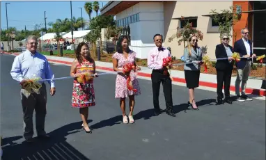  ?? RECORDER PHOTO BY ALEXIS ESPINOZA ?? (Left to right) Eric Mcconnaugh­ey, Maria Fe Agudo, Maria Perez Cunanan, Francis Cunanan, Martha Flores, Brandi Guinn and Jeff Robertson stand outside of Family Medicine Clinic for the ribbon cutting ceremony on Tuesday.