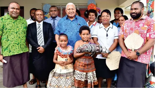  ?? Photo: FELIX LESINAIVAL­U ?? Prime Minister Voreqe Bainimaram­a with Government officials after the official opening of the Nasau Government Station last week.