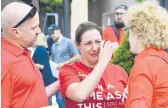  ?? JULIE BENNETT/AP 2019 ?? Sexual abuse survivor Jules Woodson of Colorado, center, is comforted at the Southern Baptist Convention’s annual meeting in Birmingham, Alabama.