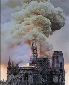  ?? AP/DIANA AYANNA ?? Flames and smoke rise as the spire on Notre Dame Cathedral collapses Monday in Paris, France.
