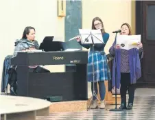  ?? ?? Bhing (right) sings during the English-language mass at Saint Blaise Catholic church in Zagreb, Croatia.