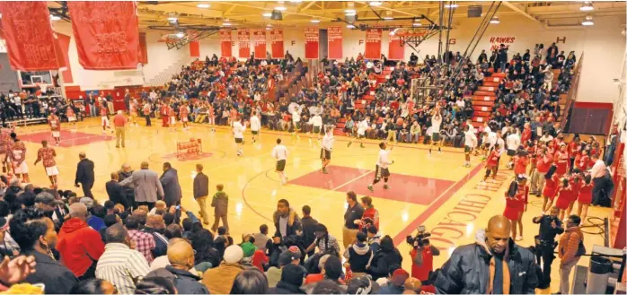  ?? SUN- TIMES ?? Winter sports are on hold because of the raging pandemic, so a packed house such as this one at the North Chicago High School gym is an impossibil­ity at this time.