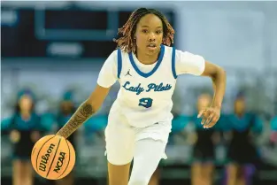  ?? STAFF FILE ?? Norview standout Kiyah Fitchett (3) dribbles as the Pilots defeated Woodside 52-24 in the Class 5 Region B girls semifinals at Scope Arena in Norfolk on Feb. 22, 2023.