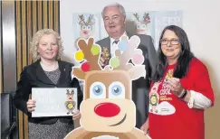  ??  ?? Support Claire Baker (left) with Usdaw divisional officer Lawrence Wason and member Jacqueline Martin promoting the unions Freedom from Fear campaign which seeks to prevent violence and abuse against shopworker­s