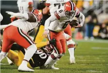  ?? Gene J. Puskar / Associated Press ?? Pittsburgh linebacker T.J. Watt brings down Cleveland’s Baker Mayfield, one of nine sacks in Monday night’s game.