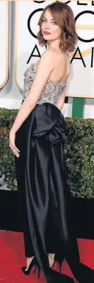  ?? STEVE GRANITZ / WIREIMAGE ?? EMMA STONE Con el conjunto de pantalón y top de Lanvin que triunfó en la gala de los Globos de Oro