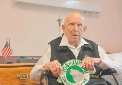  ?? | MITCH DUDEK/SUN-TIMES ?? World War II vet Stanley A. Pokrzywa — the subject of an Independen­ce Day column last week — displays his U.S. Army 104th Infantry Division Timberwolv­es patch. Pokrzywa is now living in a Morton Grove nursing home.