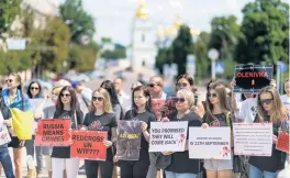  ?? DAVID GOLDMAN AP ?? Protesters in Kyiv, Ukraine, attend a rally Saturday in support of Ukrainian soldiers from the Azov Regiment who were captured by Russia in May after the fall of Mariupol.