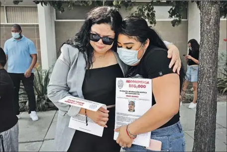  ?? Al Seib Los Angeles Times ?? REWARDS for informatio­n were offered at a May 9 news conference attended by relatives of homicide victims, including Stephanie Rodriguez, left, and Brianna Medina. The LAPD was seeking public assistance in solving three fatal shootings in the Pacoima neighborho­od.