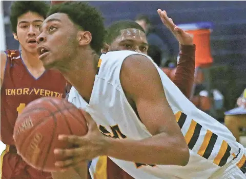  ?? JOHN KLEIN / FOR THE JOURNAL SENTINEL ?? Leading scorer and rebounder Walter Taylor is part of a seven-man senior class that captured University School’s first conference championsh­ip since 2001.