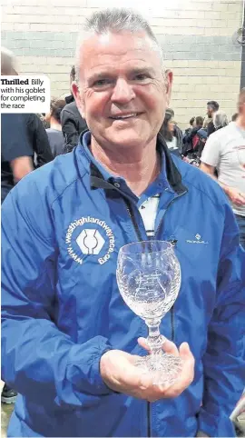  ??  ?? Thrilled Billy with his goblet for completing the race