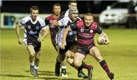  ?? Photo: Nev Madsen ?? ELSUIVE STEP: Valleys Roosters five-eighth Ben Cook is met in a tackle by Oakey Bears second-rower Aaron Cherry. Valleys prevailed 58-24.