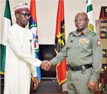  ?? Photo: NNPC ?? The Group Managing Director of the Nigerian National Petroleum Corporatio­n, Mallam Mele Kyari in a handshake with the Chief of Defence Staff, General Gabriel Olanisakin, at the Office of the Chief of Defence Staff, in Abuja yesterday