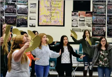  ?? RCORDER PHOTOS BY MATTHEW SARR ?? Singers in Portervill­e High School's Maadrigal's choir performing "Janger," a Balinese folk song, during rehearsal Wednesday morning.