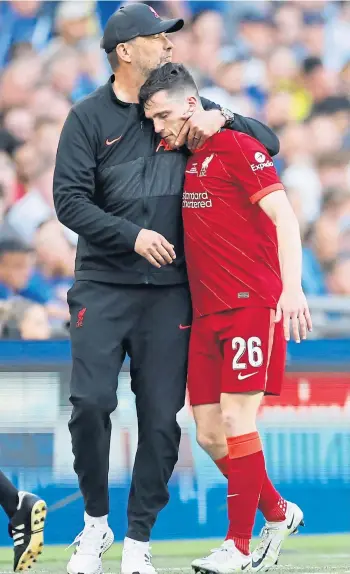  ?? ?? Jurgen Klopp consoles Andy Robertson after the Scotland captain went off injured