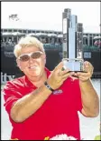  ?? DARREN CARROLL / GETTY IMAGES ?? John Daly hoists the Insperity trophy, his first on PGA Tour Champions tour.