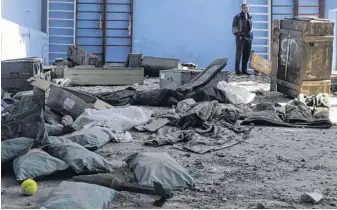  ?? REUTERS ?? A rocket is pictured inside a multi-sports court of a school, where, according to residents, Russian soldiers were based before the Ukrainian Army retook the Vilhivka village, amid Russia’s attack on Ukraine, near Kharkiv, Ukraine, Wednesday.