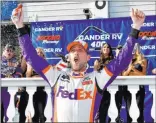  ?? Derik Hamilton The Associated Press ?? Denny Hamlin whoops it up in Victory Lane after winning the NASCAR Cup Series Gander RV 400 on Sunday in Long Pond, Pa.