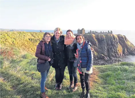  ?? ?? DESTINATIO­N: Language Travel Tours founder Clare Plaister, second left, with French teachers at Dunnottar Castle.
