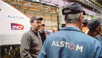  ?? AFP PIC ?? Employees at Alstom’s TGV high-speed train factory in Belfort, eastern France. The Siemens and Alstom transport businesses span the TGV and German ICE highspeed trains as well as signalling and rail technology.