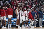  ?? MICHAEL CONROY — THE ASSOCIATED PRESS ?? The Florida Atlantic bench celebrates in the second half of a second-round game against Fairleigh Dickinson in the men's NCAA Tournament in Columbus, Ohio, on Sunday. Florida Atlantic defeated Fairleigh Dickinson 78-70.