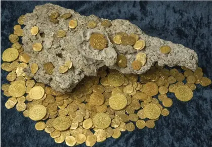  ?? ?? Spanish gold coins recovered near Florida. The San José shipwreck could contain more than 3,000 times the amount shown here. Photograph: 1715 Fleet/Queens Jewels LLC/Reuters