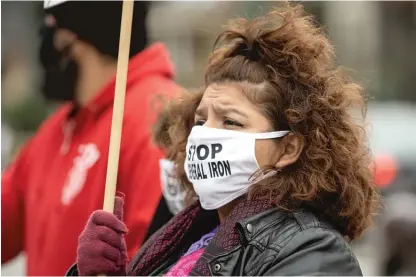  ?? PAT NABONG/SUN-TIMES FILE ?? Nelly Martinez attends a November rally to demand Mayor Lori Lightfoot deny the final permit that will allow General Iron to move from Lincoln Park, a mostly white neighborho­od, to the Southeast Side, with a mostly Latino population.