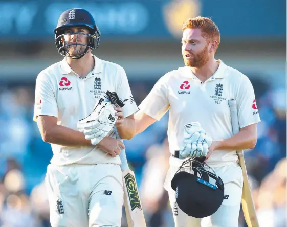  ?? Picture: AAP ?? England batsmen Dawid Malan (left) and Jonny Bairstow walk from the field at stumps on Day 1 of the Third Ashes Test in Perth.