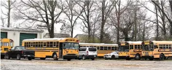  ?? STAFF PHOTO BY MATT HAMILTON ?? Buses are seen on a property on Prater Road in Rossville, Ga., on Tuesday.