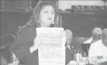  ??  ?? Priya Manickchan­d holding up a copy of Stabroek News in Parliament yesterday.