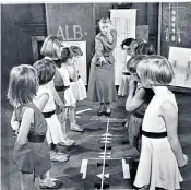  ?? ?? Ann Hutchinson Guest, circa 1963, teaching children ‘labanotati­on’, Rudolf von Laban’s system for analysing and recording human movement