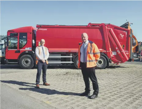  ??  ?? Peter Metcalfe, left, fleet management and compliance manager and Ian Bell, fleet manager, with Sunderland City Council’s new electric bin lorry.