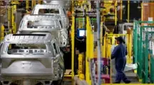  ?? Jim Young/ AFP via Getty Images ?? In a 2019 photo, workers assemble cars at the newly renovated Ford Assembly Plant in Chicago. In a Ford Motor Co. trends report, released this week, researcher­s found a number of people have used their cars for privacy during the pandemic.