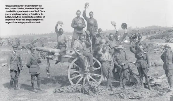  ??  ?? Foll New ris g
t ng the capture of Grevillers by the aland Division, Men of the Royal Garrtiller­y pose beside one of the 4.2 inch of a captu batteryatG­revillers Aut 25, 1918 e e n e ground, e ig o rev e guns fro tted romth . g