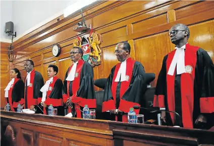  ?? Picture: REUTERS ?? QUICKLY DISMISSED: Kenya’s Supreme Court judges arrive at the court room before delivering a ruling on cases that seek to nullify the re-election of President Uhuru Kenyatta last month, in Nairobi yesterday