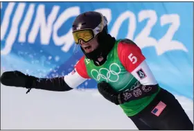  ?? (AP/Lee Jin-man) ?? Lindsey Jacobellis of the United States won the gold medal in snowboardc­ross racing, 16 years after giving away a gold medal in Italy with a showboat move near the finish line. Jacobellis, 36, became the oldest U.S. woman to win a gold medal in Winter Games history.