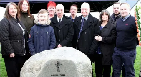  ?? Members of the McKeown family at the memorial to their relative Tommy McKeown, and Josie Ferguson. ??