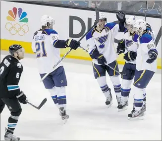  ?? Robert Galbraith, Reuters ?? St. Louis Blues’ Alexander Steen (second right) celebrates his power-play goal with teammates Monday.