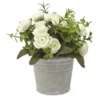  ??  ?? White artificial flowers in a concrete pot have a rustic appeal, £8, Morrisons Buy now with Ownable