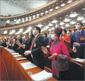  ?? WANG YUGUO / XINHUA ?? Deputies to the National People’s Congress attend the first session of the 14th NPC on March 5. The session runs until March 13.