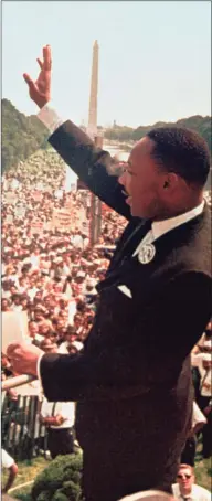 ?? AP ?? Dr. Martin Luther King Jr. waves to the crowd at the Lincoln Memorial before his “I Have a Dream” speech Aug. 28, 1963 in Washington, D.C.