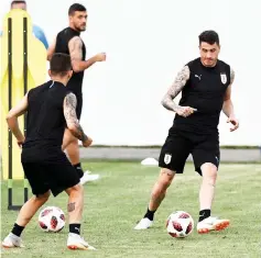  ??  ?? Uruguay’s defender Jose Gimenez (right) controls the ball as he takes part in a training session of Uruguay’s national football team at the Park Arena in Sochi. — AFP photo