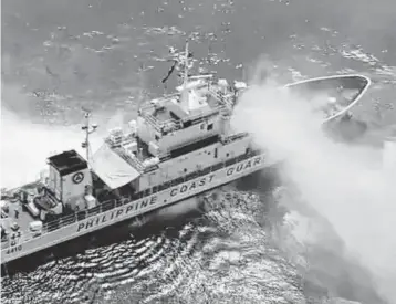  ?? PHILIPPINE COAST GUARD SPOKESMAN ?? In this screengrab made from video, Chinese vessels fire water cannons at Philippine coast guard ships, damaging one, in the disputed waters of the South China Sea near the Scarboroug­h Shoal, a Philippine coast guard official said Tuesday.