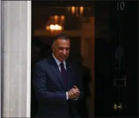  ?? (Bloomberg News/Simon Dawson) ?? Mustafa al-Kadhimi, Iraq’s prime minister, departs from No. 10 Downing St. after a meeting last month with Boris Johnson, the U.K. prime minister.