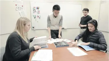  ?? NICK PROCAYLO ?? Language students Caitlin Jeangrand, left, Evan Chiles and Emily Nguyen learn Mandarin with instructor Patrick Yan through the New Occidental Education and Technology.